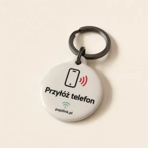 Zawieszka NFC PupiLink, przód z napisem Przyłóż telefon